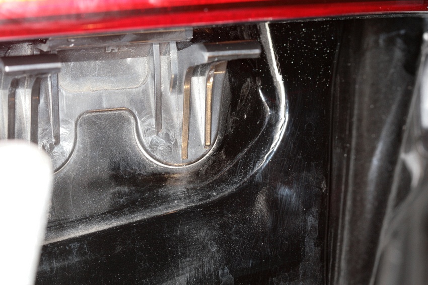 With the tail light assembly attached and bumper cover off, seam separation is visible