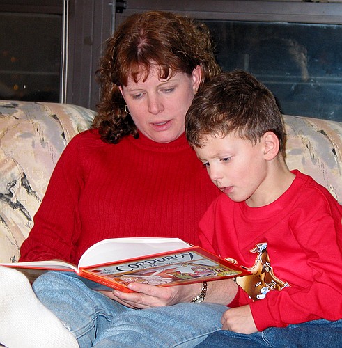 Linda reads a story to Jen