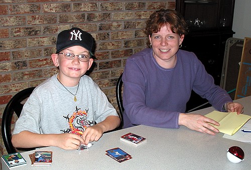 Linda and Joe look up from baseball card trading