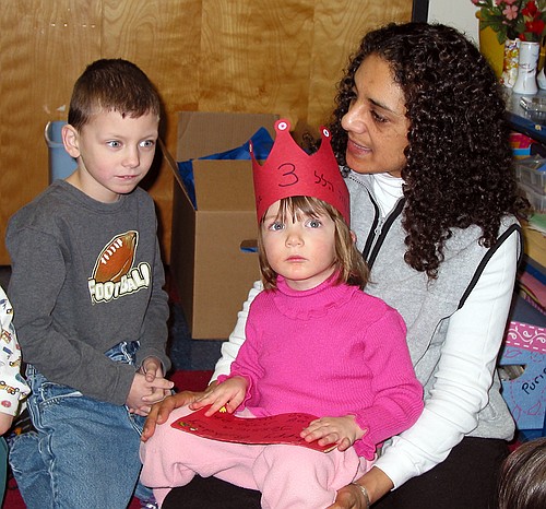 Jay sits with Morah Hagit at her school birthday party.