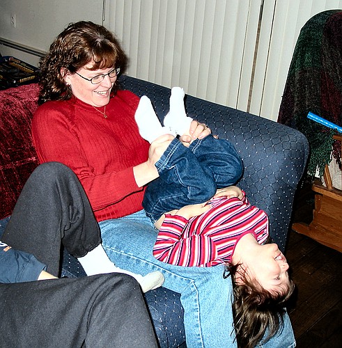 Linda hangs Jay upside-down