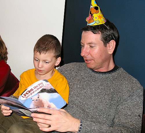 Big Joe reads Jonathan birthday card to Jennifer