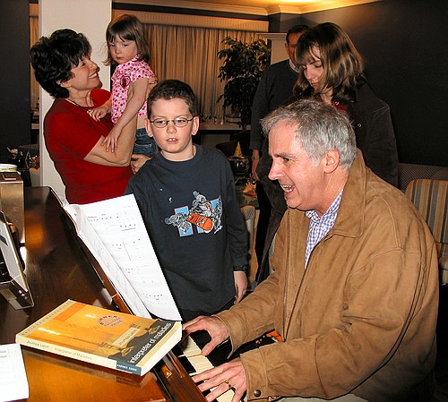 Uncle Jonathan plays some music while the crew watches