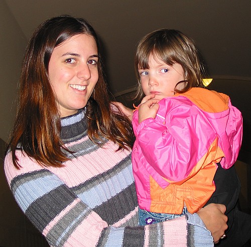 Jay watches the dinosaurs from the safety of Aunt Kim's arms